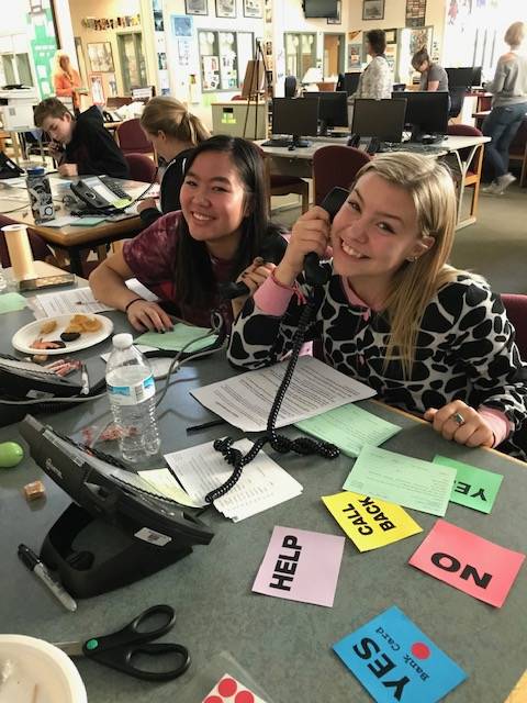 Contributed photo                                Olivia Meenan and Bristol Halverson make calls during the 2018 Phone-A-Thon.