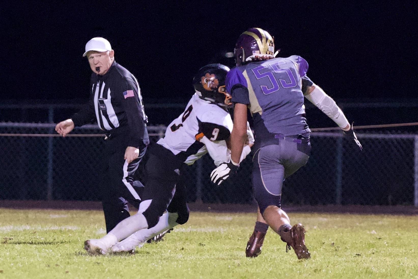 Austin Wynne, No. 55, closes in for the tackle of a Tigers’ ball carrier. (John Stimpson/contributed photo)