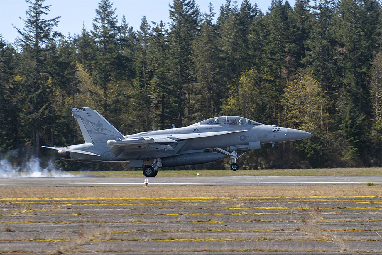 An EA-18G Growler assigned to the “Lancers” of Electronic Attack Squadron (VAQ) 131 lands during a Field Carrier Landing Practice at an outlying landing field attached to Naval Air Station Whidbey Island. (U.S. Navy photo by Mass Communication Specialist 2nd Class Marc Cuenca/Released)