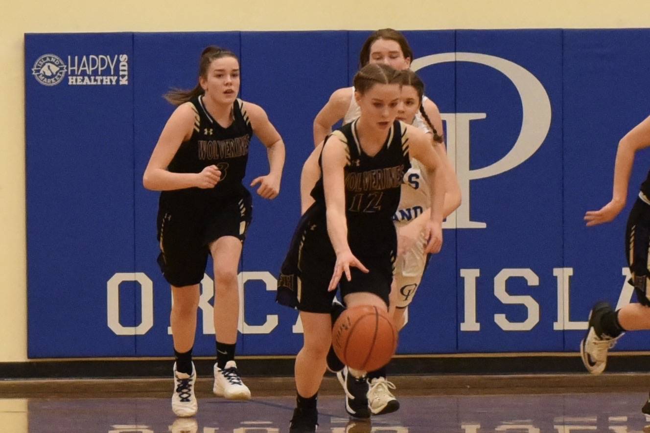 Olivia Germain leads a fast break down court with Rachel Starr close behind. (Contributed photo. John Stimpson.)