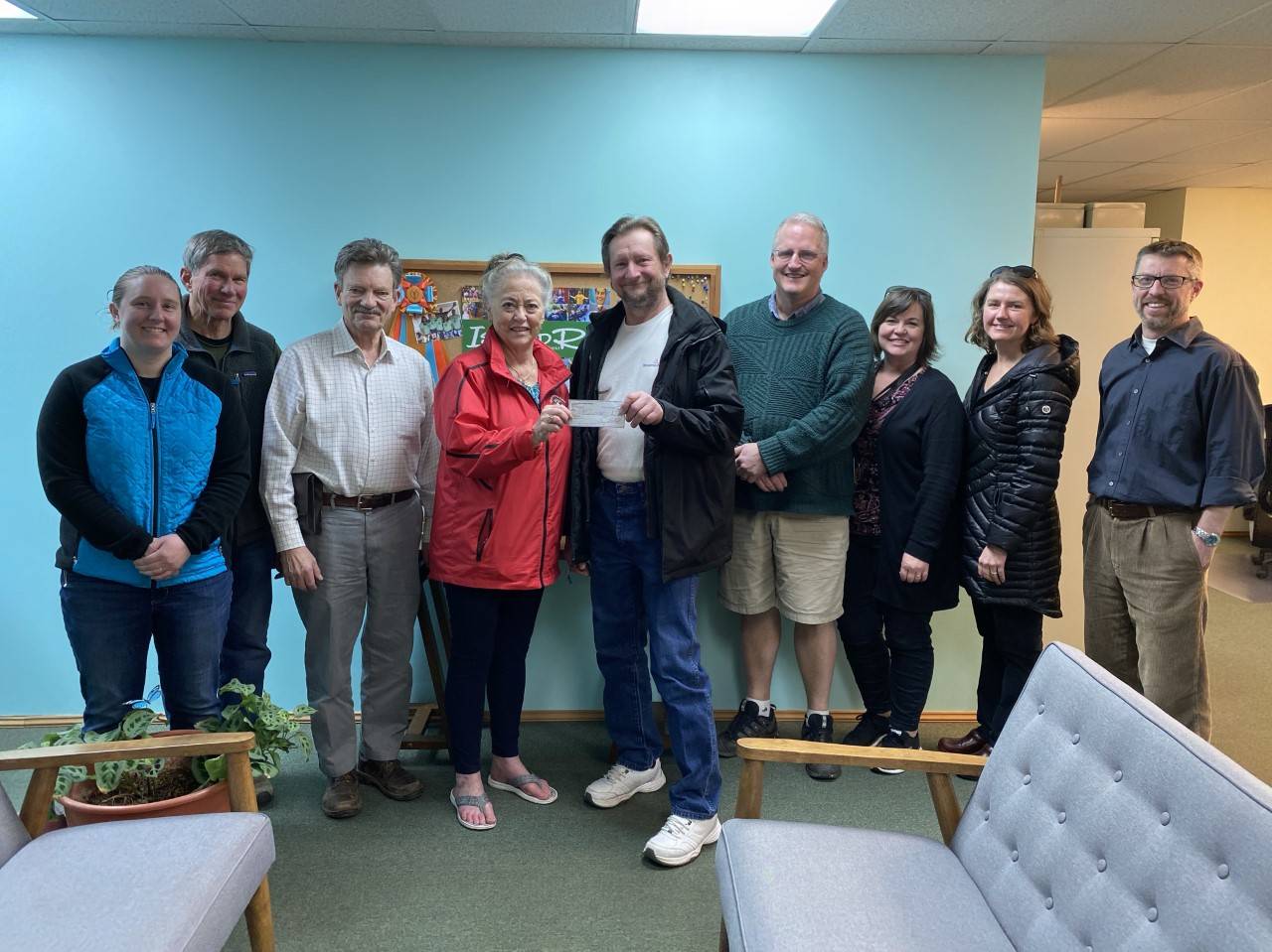Vicky Thalacker, Friday Harbor Kiwanis Club Past President, presents a check for $500 from FH Kiwanis to David Stegman, FANS President. (Contributed photo.)