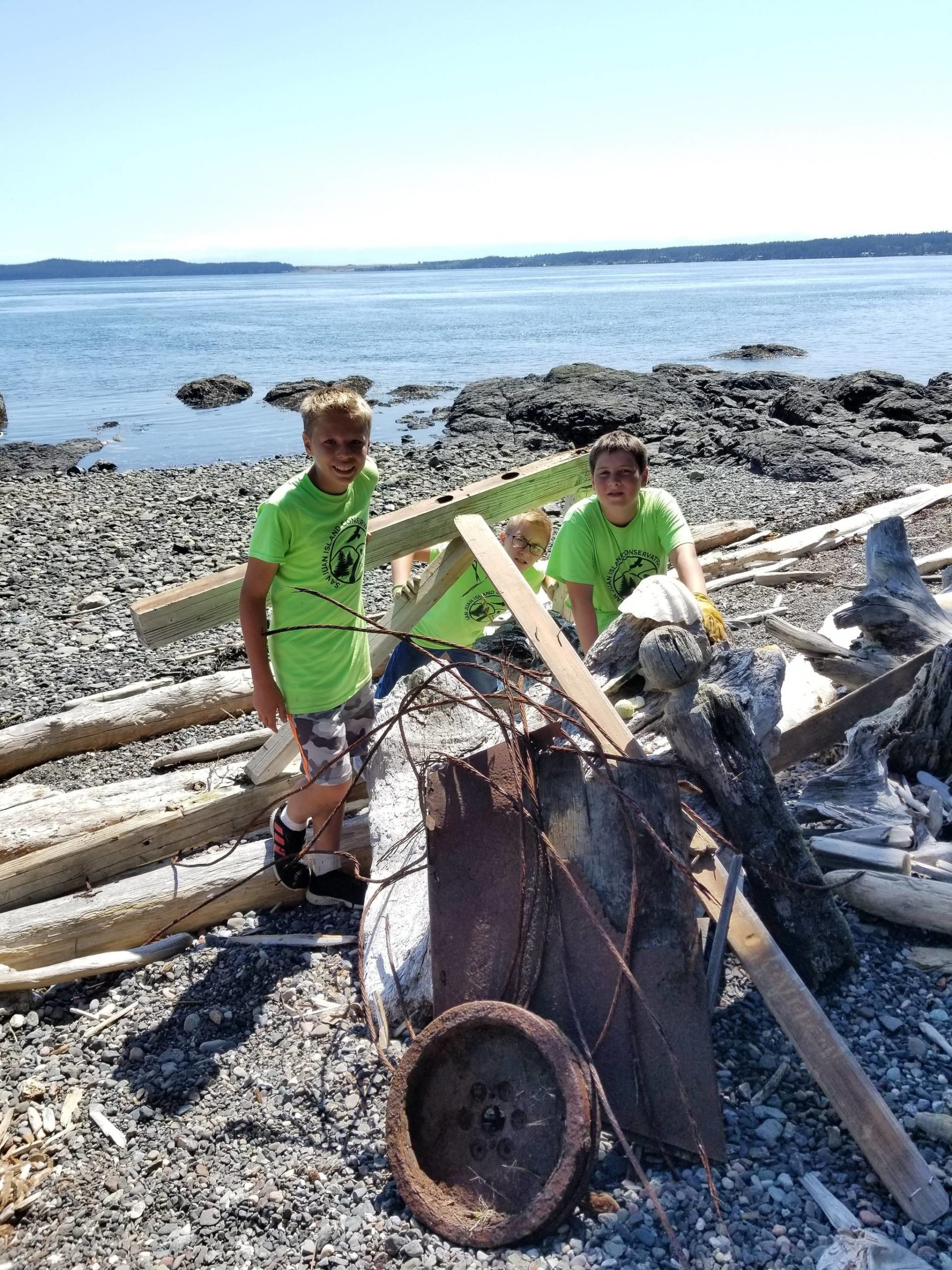 Brendan Reiff, Malachi Cullen and Aiden Greene participate in a Youth Conservation Corpse beach clean-up at Jackson Beach in July 2019. (Contributed photo)