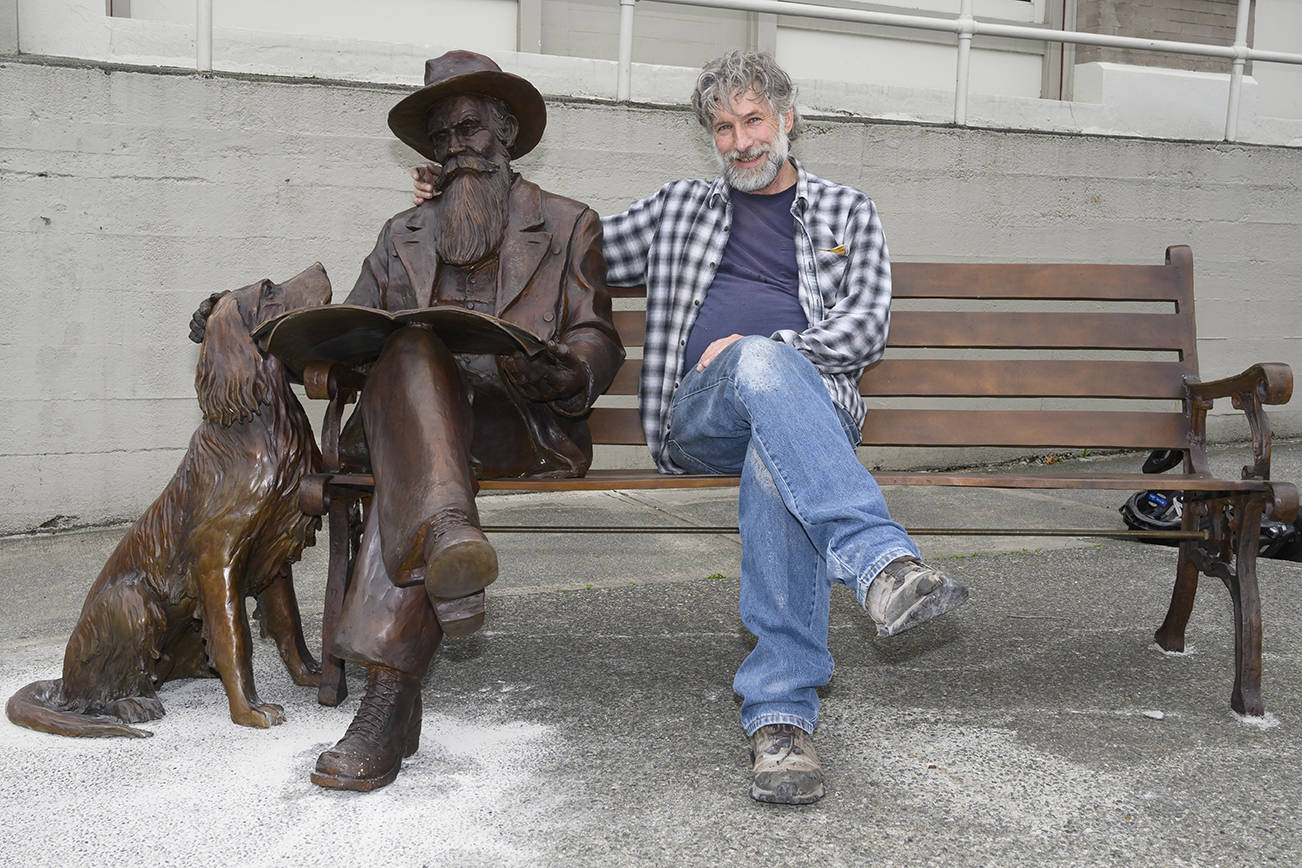 Sculptor Gareth Curtiss, right, with his statue of Friday Harbor founder Edward Warbass and Bob the dog. (Matt Pranger/contributed photo)