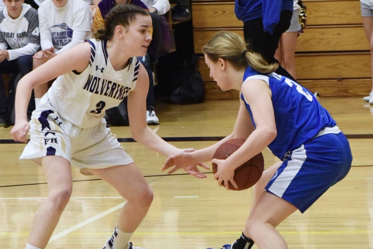 John Stimpson/contributed photo
Island rivals, the Friday Harbor Wolverines and the Orcas Island Vikings face girls basketball teams face off in this photo from Feb. 5, 2020.