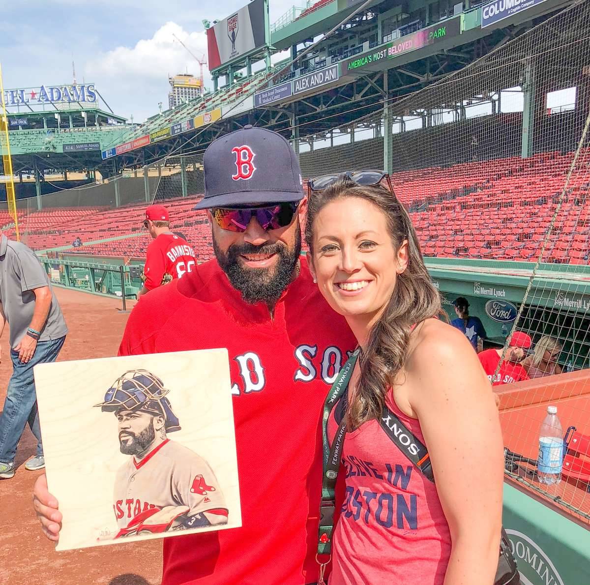 Lauren Taylor, right, and Sandy León pose with an illustration Taylor made of the former Red Sox catcher. (Contributed photo)