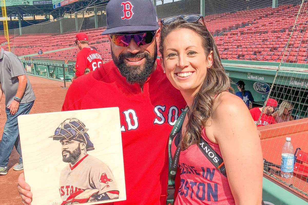 Lauren Taylor, right, and Sandy León pose with an illustration Taylor made of the former Red Sox catcher. (Contributed photo)