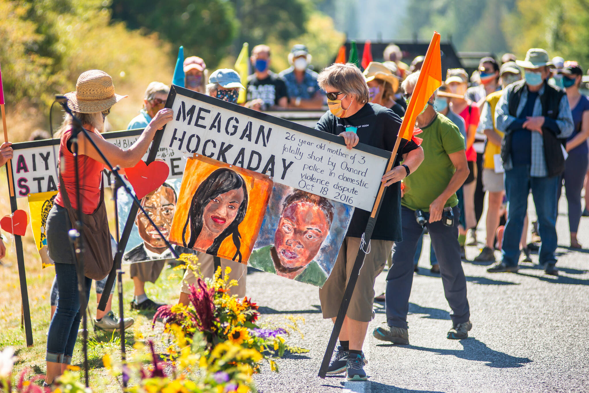 Lopezians gathered to honor Black lives lost as they respectfully removed memorial signs along the side of Fisherman Bay Road on Sept. 6, 2020. (Robert S. Harrison/contributed photo)