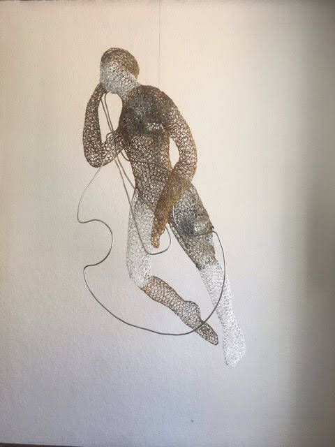 Francie Allen’s work consists of sculpted of wire and lacey metal netting.