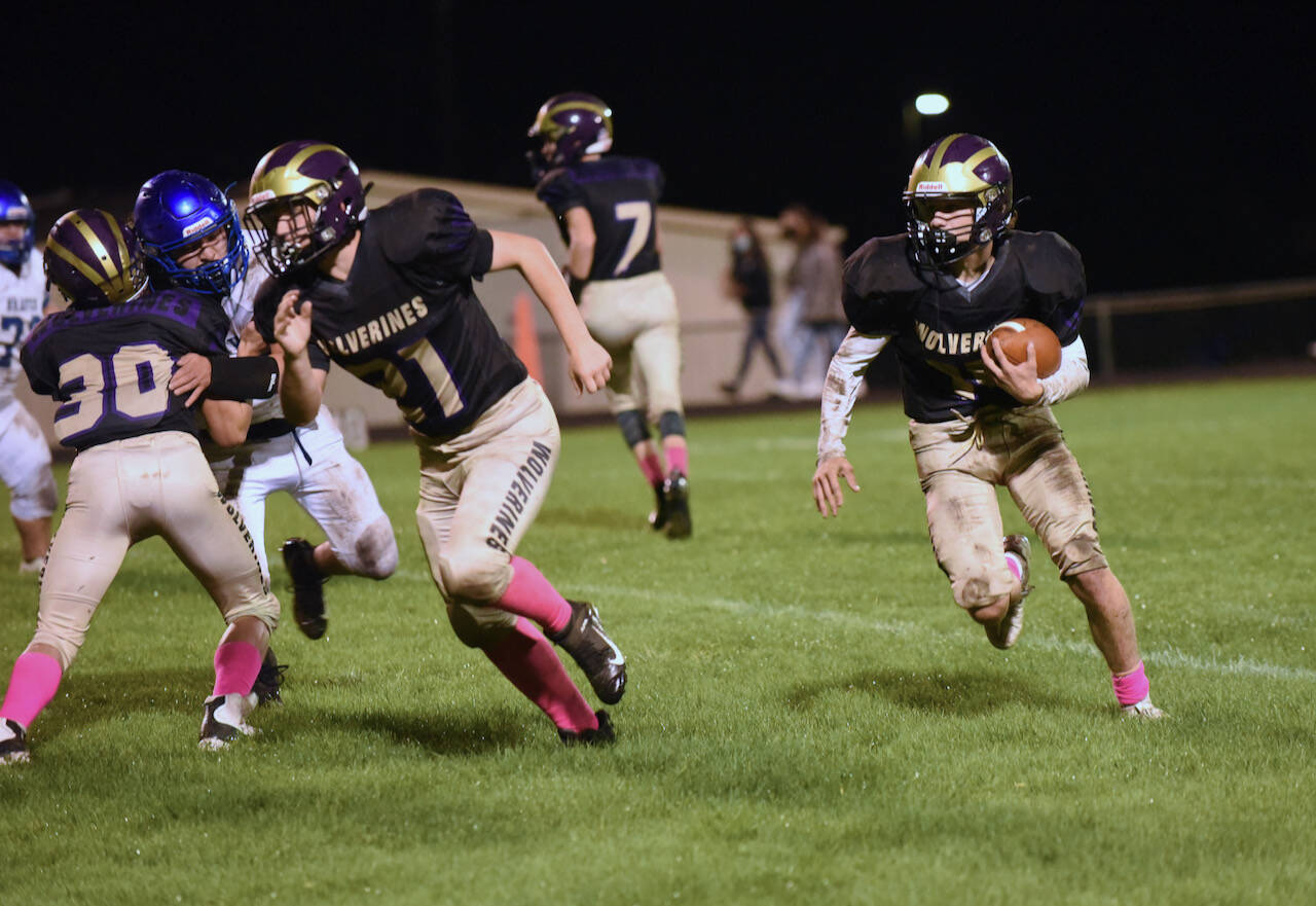John Stimpson photo
Wolverine Connor Haines #14 and Cody Anderson #21 make their way up field.