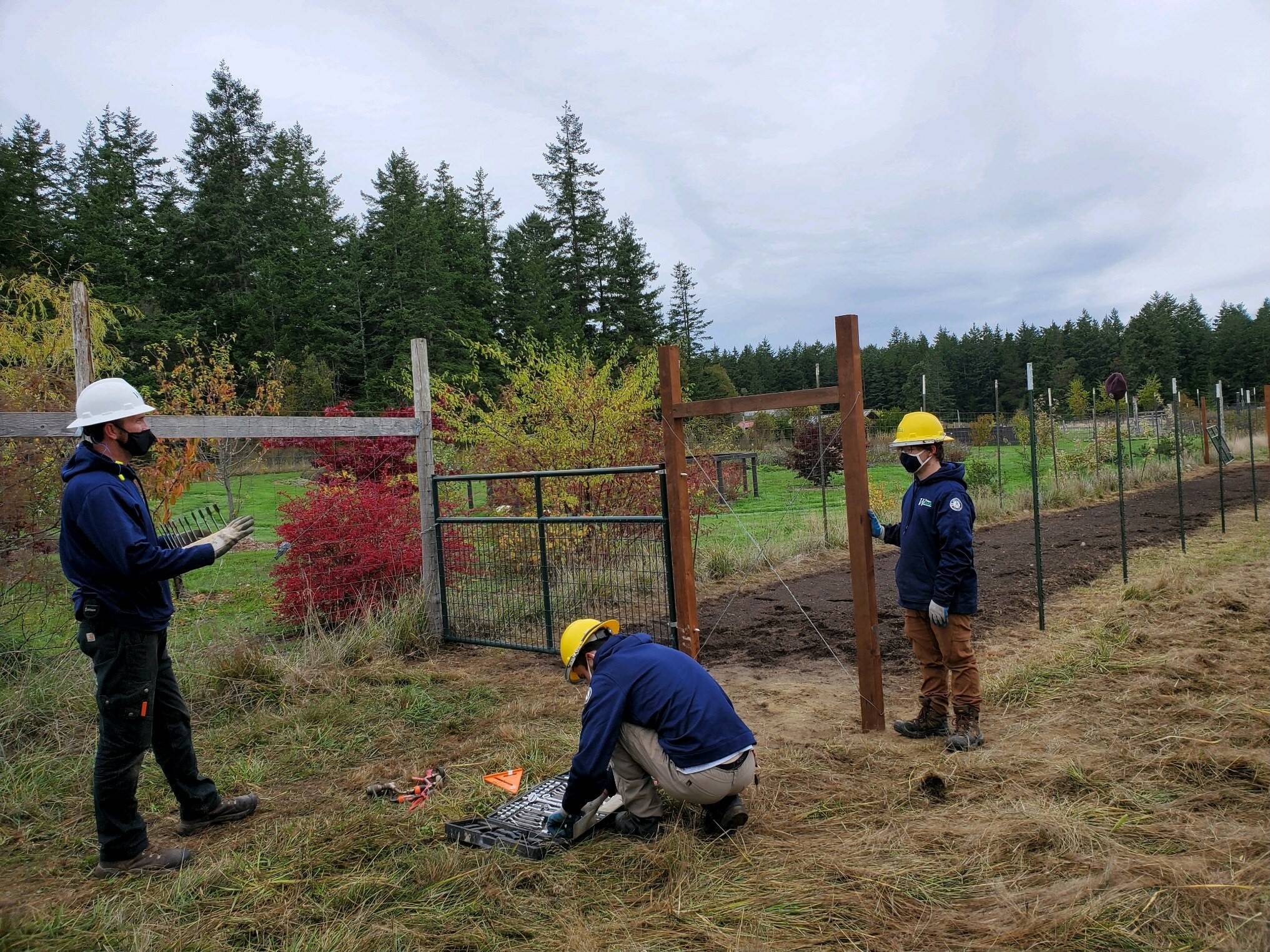 Contributed photo
Washington Conservation Corps crew members discuss the finer points of fence construction.