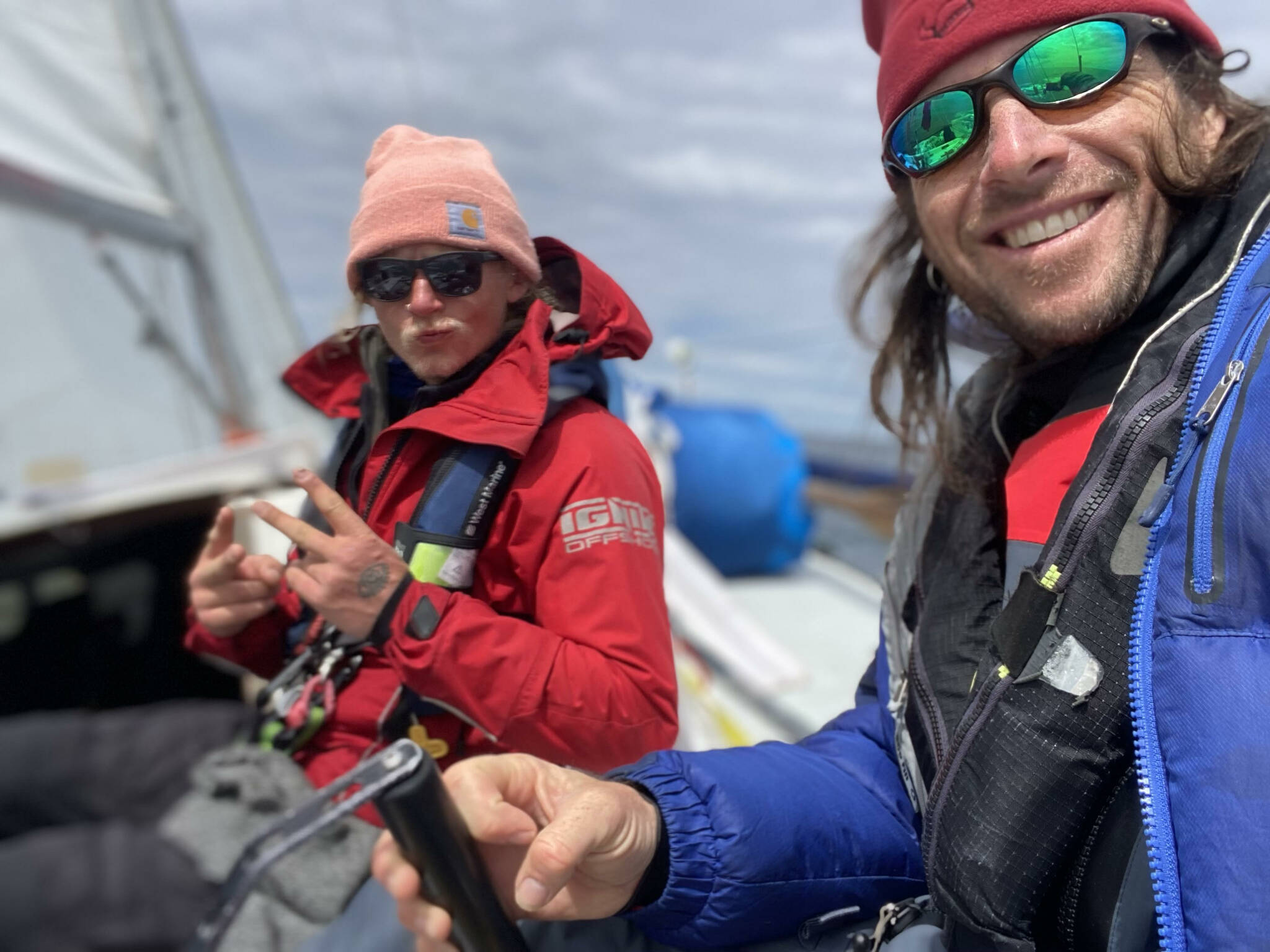 Team Elsewhere crew member Odin Smith and Captain Rhys Balmer smile during the 2022 R2AK Race To Alaska.