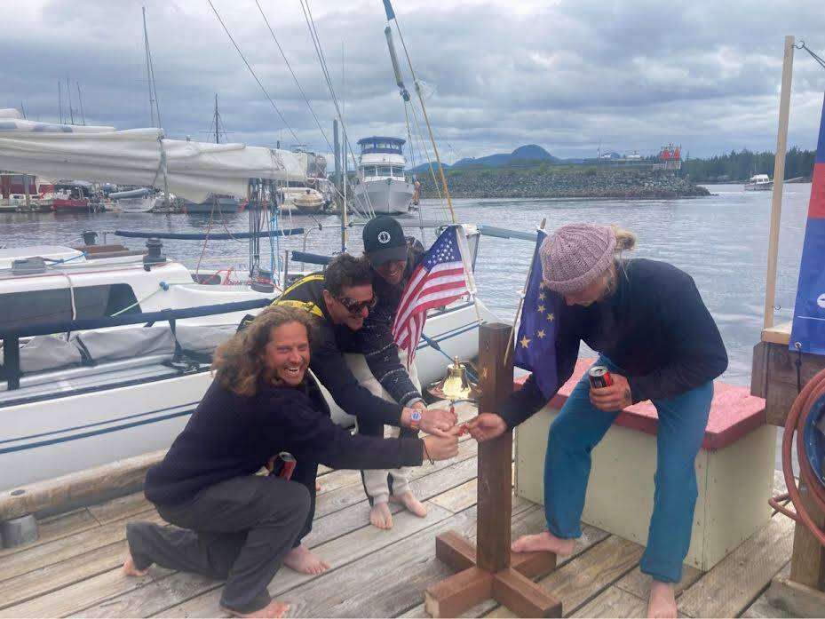 Team Elsewhere pose at the finish line of the 2022 R2AK Race to Alaska, in Ketchikan Alaska.