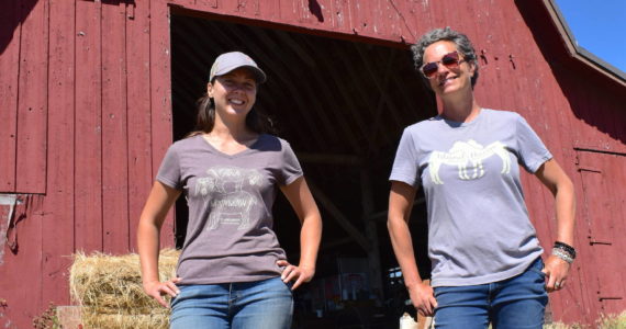 Kelley Balcomb-Bartok  Staff photo
Braunti Cobb and Julie Duke stand in front of the barn that houses all the animal feed for the sanctuary.