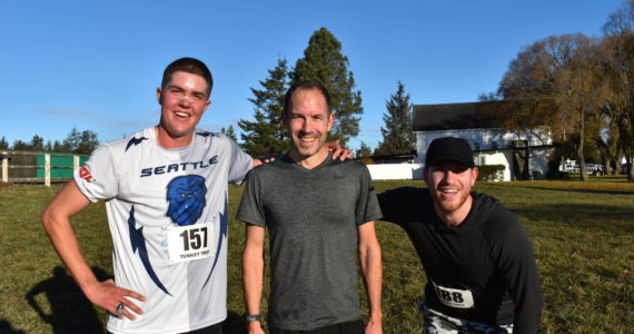 Kelley Balcomb-Bartok / Staff photo.
Top finishers of the 2022 Turkey Trot. From left: Third Place finisher, Friday Harbor Resident and FHHS Class of 2017 Alumni Joe Stewart; First Place Finisher, Dietrich Wieland from Portland; and Second Place Finisher Jack Verzuh of Seattle.