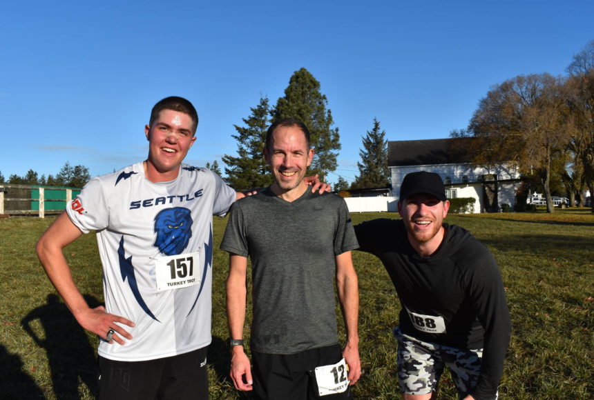 <p>Kelley Balcomb-Bartok / Staff photo.</p>
                                <p>Top finishers of the 2022 Turkey Trot. From left: Third Place finisher, Friday Harbor Resident and FHHS Class of 2017 Alumni Joe Stewart; First Place Finisher, Dietrich Wieland from Portland; and Second Place Finisher Jack Verzuh of Seattle.</p>