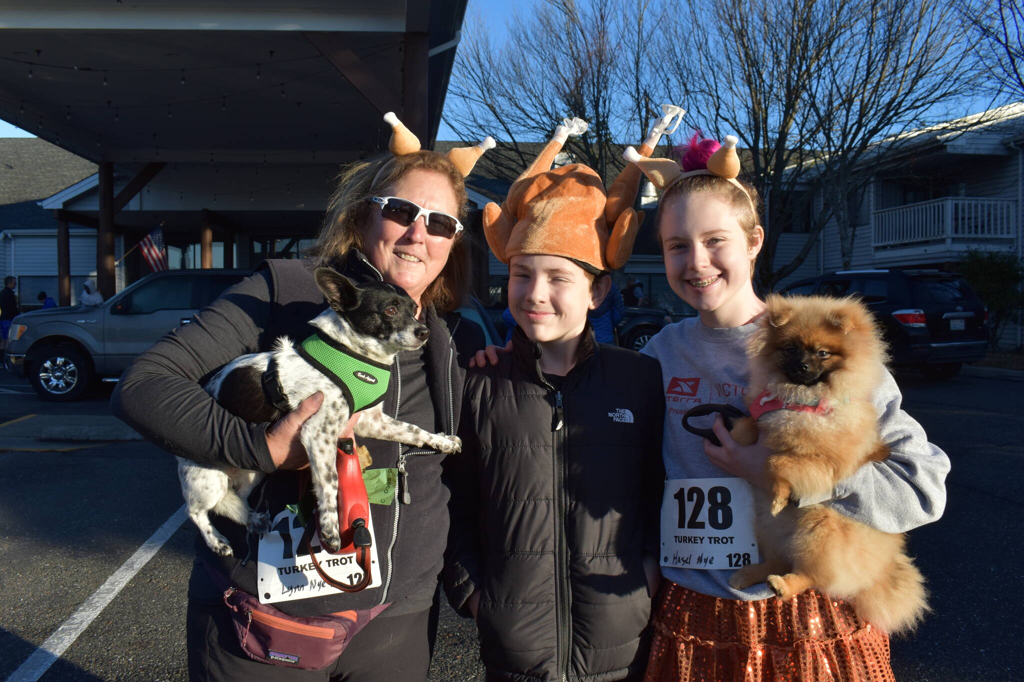 Kelley Balcomb-Bartok\ Staff photo
2022 Turkey Trot Participants prepare for the race. From left, Gram Lynn with Moose, Clive, and Hazel with Jellybean.