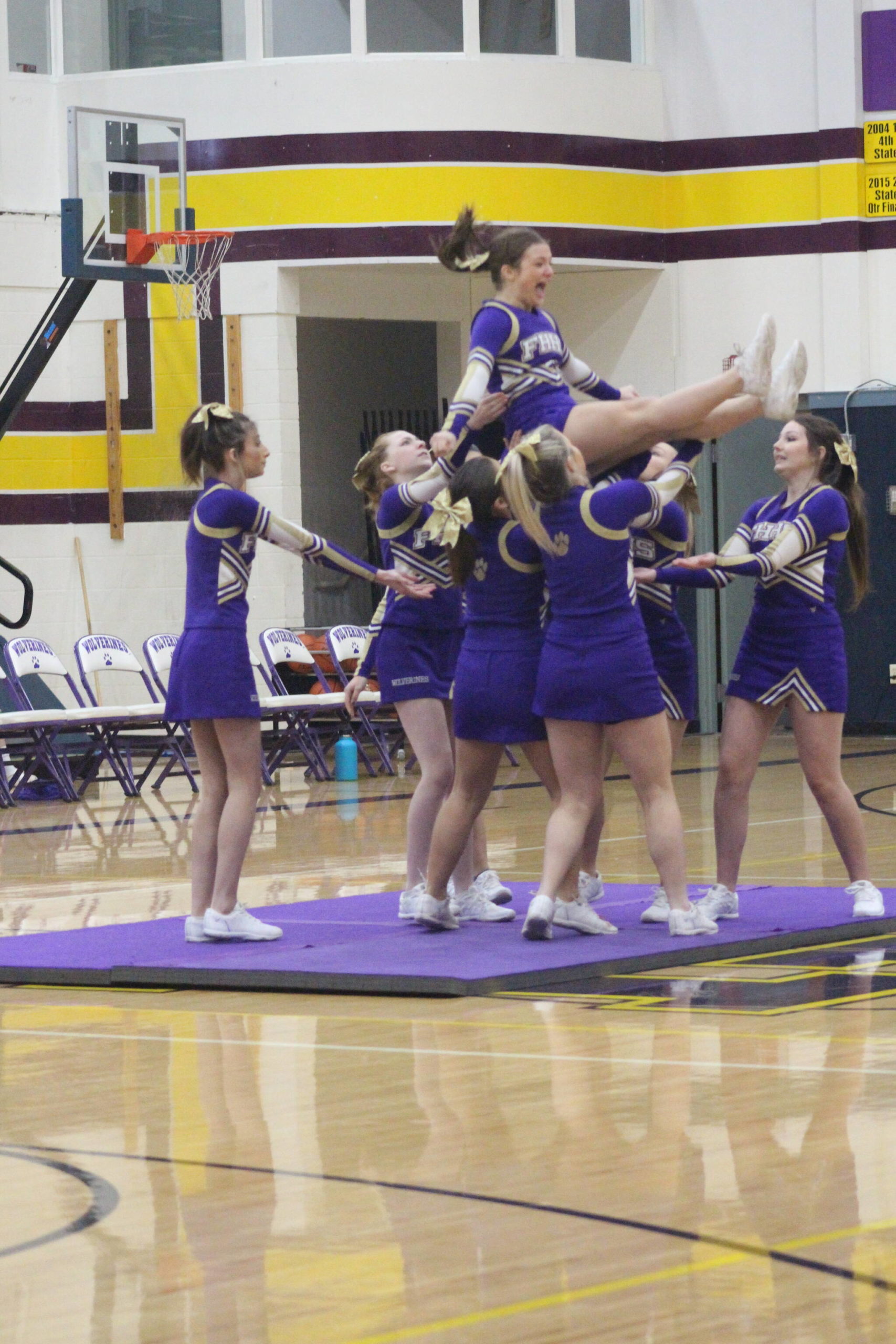 Heather Spaulding \ Staff photo
Wolverine Cheer Squad brings on the gymnastics during half-time