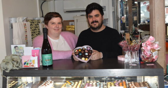 Kelley Balcomb-Bartok Staff photo
Kathryn and Roberto Moya celebrate Valentine’s Day and their new community with a box of chocolates and other fine local goodies at their store.