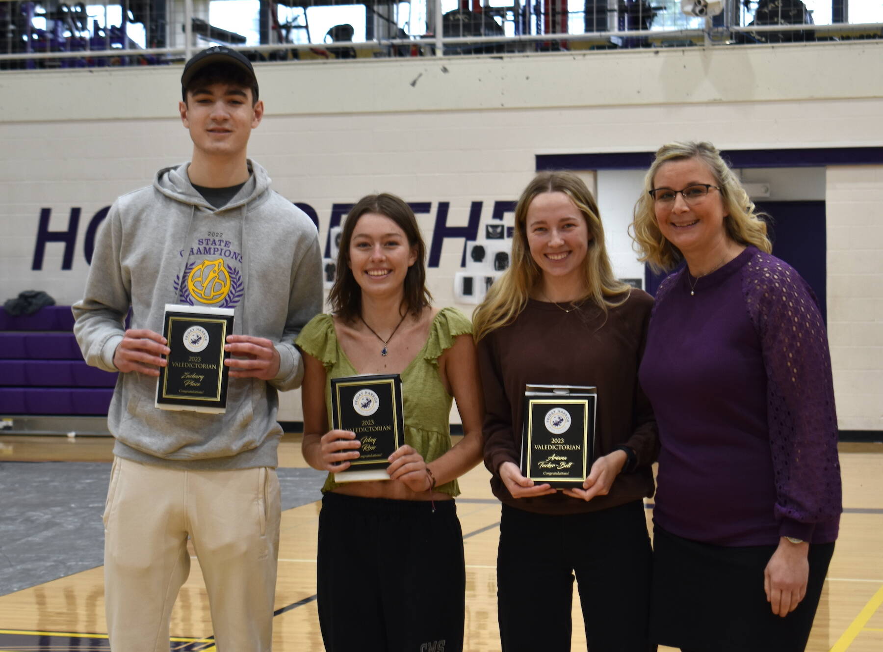Staff photo by Kelley Balcomb-Bartok
Friday Harbor High School Co-Valedictorians Zachary Place, Islay Ross, and Ariana Tucker-Belt were presented honorary awards by Principal Andrea Hillman during the FHHS Celebration of Academics event held March 10 in the Turnball Gym.