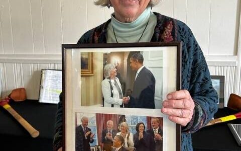 Heather Spaulding \ Staff photo
Asha Lena holding a photo of her with President Obama.