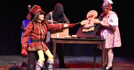 Kelley Balcomb-Bartok / Staff photo
Lord Farquaad, a tyrannical dictator who will do anything to become king, tortures 'Gingy' the Gingerbread Man (Ashlynn Wilson) trying to extract information about the whereabouts of Princess Fiona.