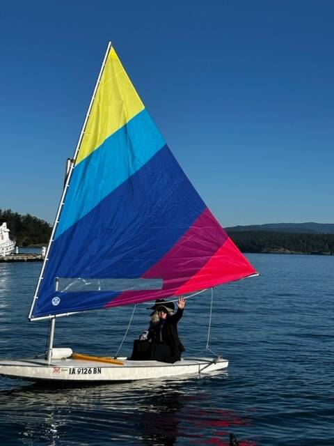 Heather Spaulding \ Staff photo
A witch shows off her boat’s colorful sail.
