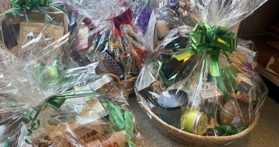Some of the holiday baskets awaiting your bids at this year at the library's annual fundraiser. / CONTRIBUTED PHOTO
