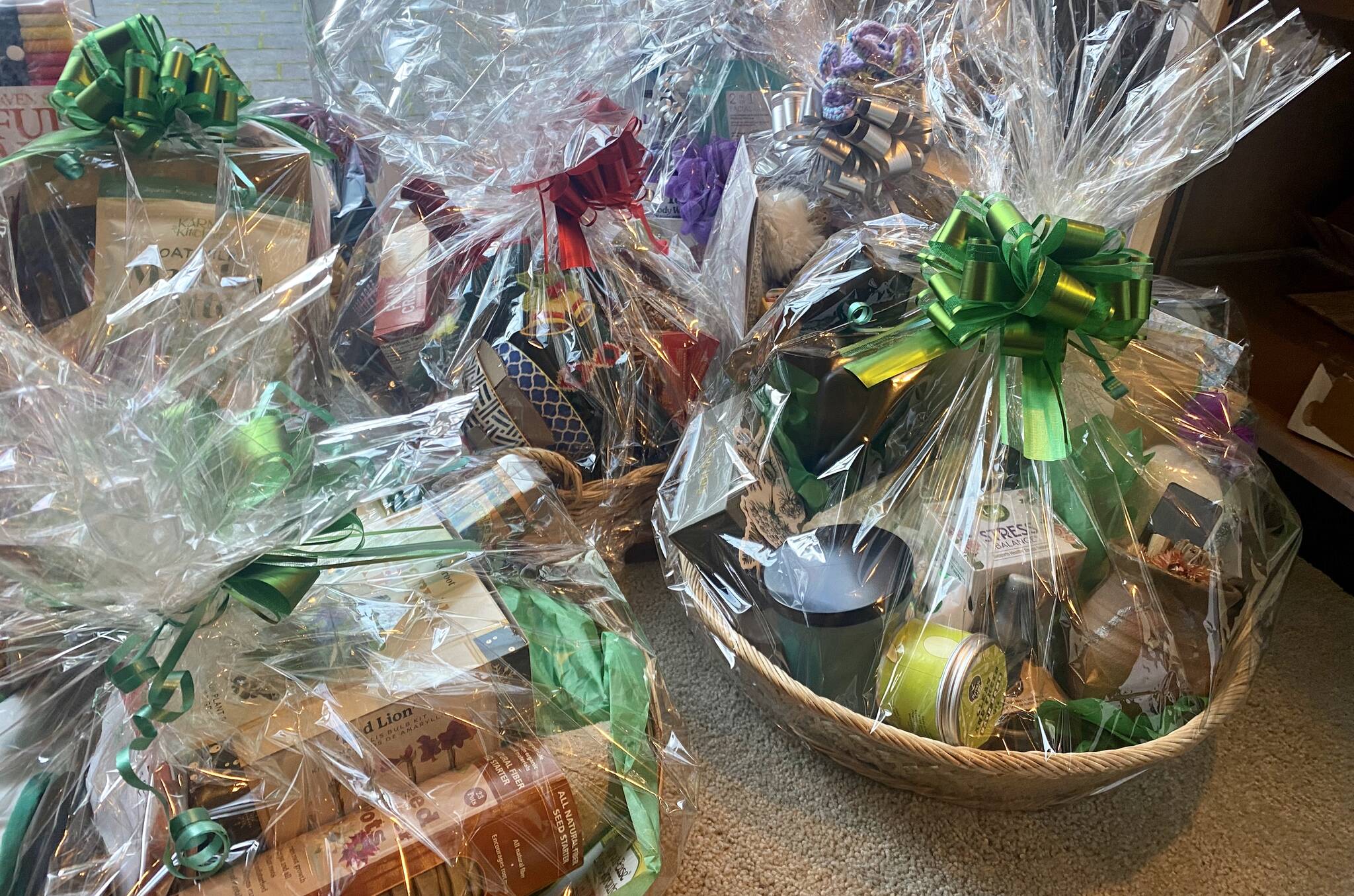 Some of the holiday baskets awaiting your bids at this year at the library's annual fundraiser. / CONTRIBUTED PHOTO