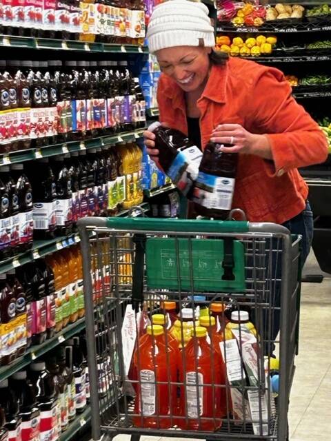 Heather Spaulding \ Staff photo
Rachelle Radonski grabbing juice for families in need