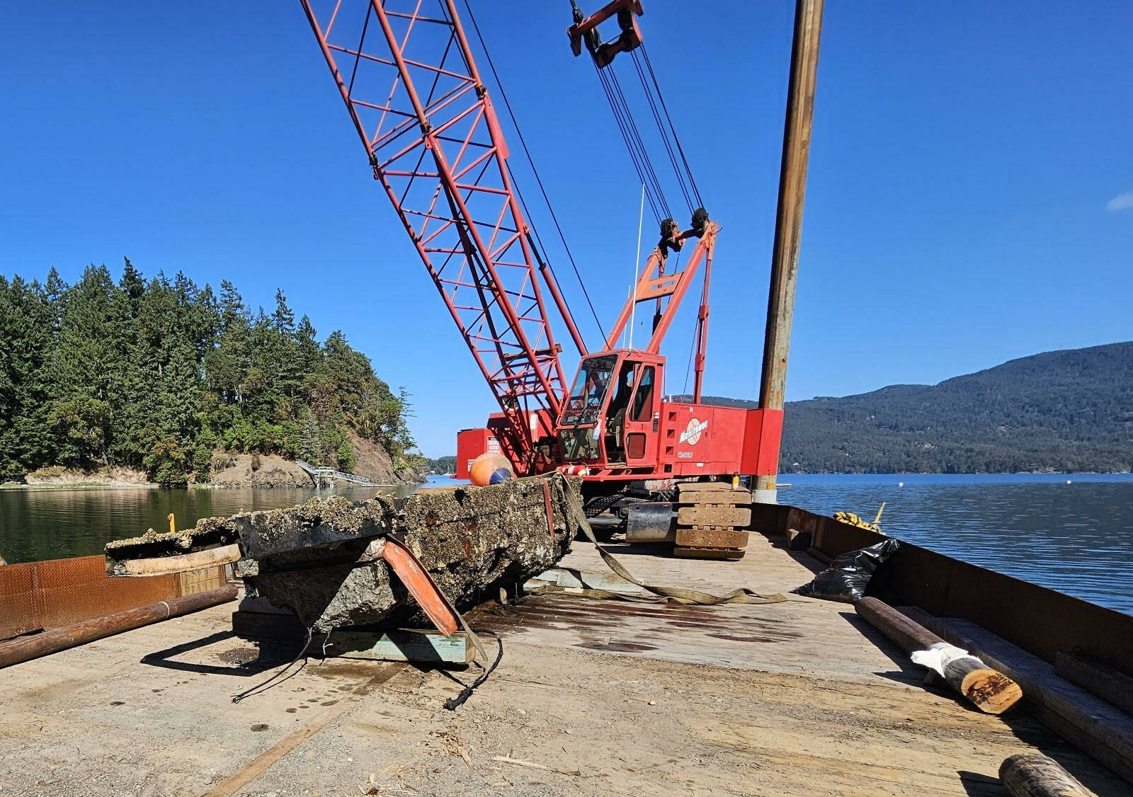 Contributed photo
Local contractor A1 Marine e removes a derelict concrete structure from Judd Cove Preserve on Orcas Island.