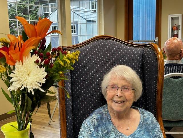 Heather Spaulding/Staff photo
Dorothy Martyn sits on the Birthday Throne with her flowers.