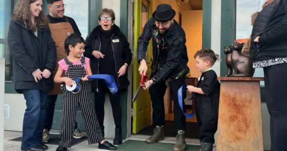 Contributed photo
Nate Fihn cuts the ribbon held by his two childen. Chamber Director Becki Day, President Roberto Moya and board member Deborah Hoskins cheer them on.