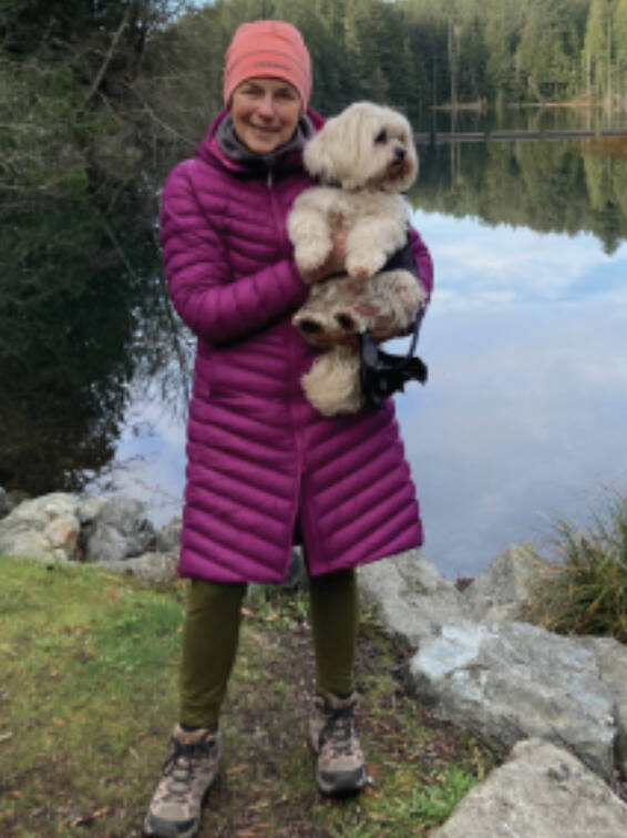RA Cook with her dog, Stuart, in the San Juan Islands.