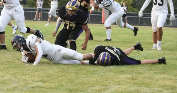 Contributed photo by John Simpson
Friday Harbor #1 Ben Baisch brings down Cedar Park running back.