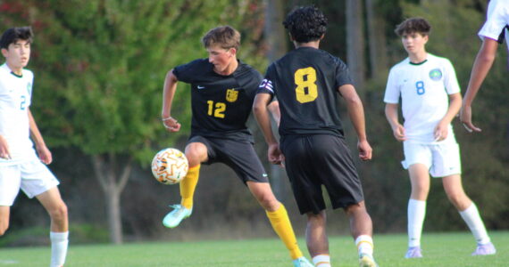 Wolvereines intercept a pass between the Vikings during the Oct. 2 game at Linde Fields.