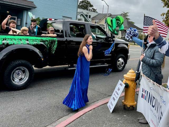 Contributed photo
Indivisible cheered on high school students during the Homecoming parade Oct. 3.