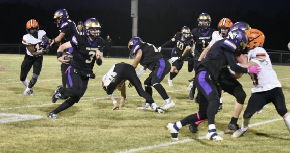 John Stimpson photo.
Wolverine # 3 Jackson Felix runs for a big yardage gain.