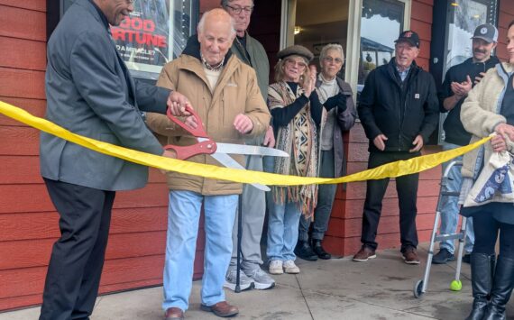 Contributed photo by Norris Palmer
Mayor Ray Jackson cuts the ribbon while Jerry Alhadeff looks on.