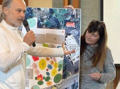 Heather Spaudling/staff photo.
Representatives from one table talk about the map they created.