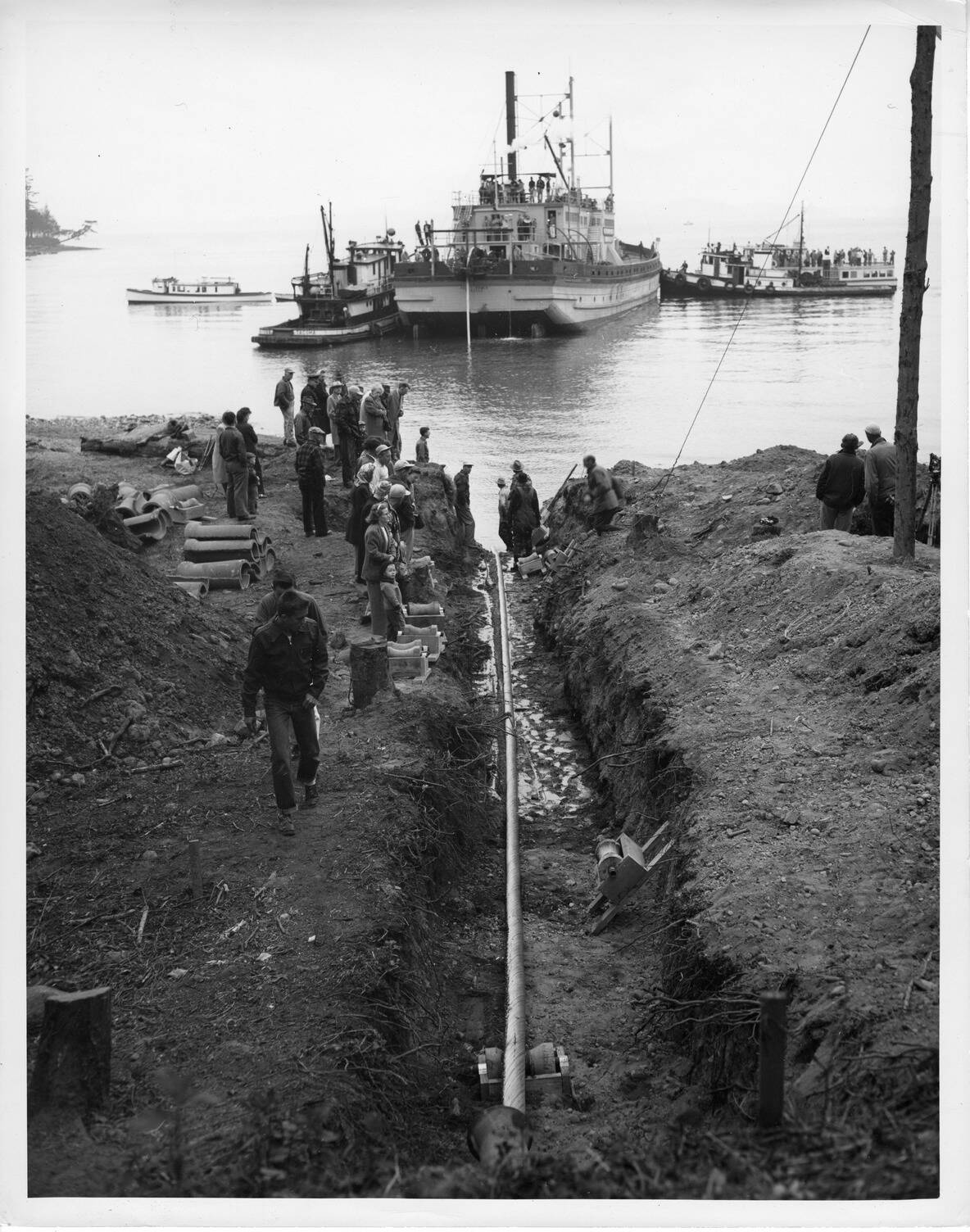 Contributed photo
In 1951, Bonneville Power Administration engineers completed the installation of a 7.5-mile, 25,000-volt submarine power cable connecting Anacortes to Decatur Island, which was the worlds longest underwater power line at that time. Approximately 500 spectators gathered along the shoreline, and boats paused their travel to observe the final five miles of high-voltage cable being laid across the bottom of Rosario Strait. Photo courtesy of Bonneville Power Administration.