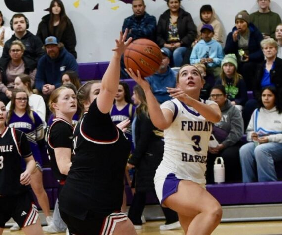 <p>Contributed photo by John Stimpson</p>
                                <p>Caylee Morton, #3, scores two points underneath.</p>