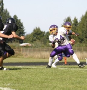 Running back Austin Scheffer (24) and quarterback Michael Ausilio
