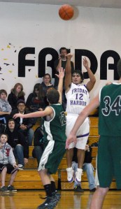 Roy Taylor (12) swished a three-pointer to bring Friday Harbor to within three points of the lead vs. Coupeville Dec. 22. In this Dec. 18 photo