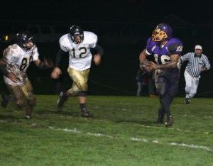Quarterback Roy Taylor (16) scrambles and looks downfield for an open receiver in the Wolverines’ 18-6 Homecoming loss Friday against Meridian.