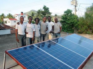 The team with their newly installed solar panel in Haiti.