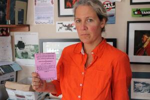 Friends of the San Juans’ Stephanie Buffum holds a drift-card. The cards