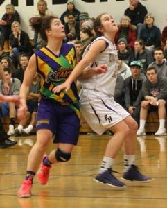 Friday Harbor's Lili Wood battles for rebounding position against Tiah Irons of Australia's Mornington Breakers Jan. 3 in Friday Harbor.