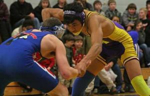 Friday Harbor’s Marquis Napier sizes up an opponent moments before pinning his La Conner rival in the Wolverines 36-34 team victory