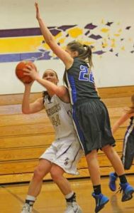 A pump fake by Friday Harbor's Tabatha Keane gets South Whidbey defender Abby Hodson off her feet. Keane scored 19 points in the Wolverines 55-21 victory over at home over the Falcons