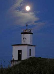 July's 'Super-moon' rises over Cattle Point Lighthouse at the southend of San Juan Island